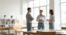 Three colleagues talking in an office